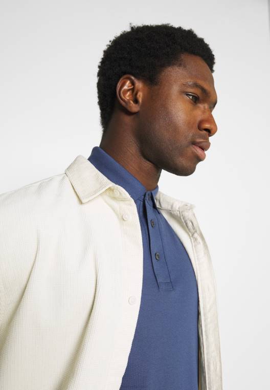 חולצת פולו NX204060 אינדיגו דהוי Tommy Hilfiger