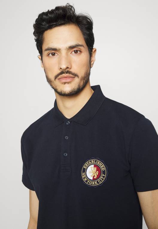 סמל חולצת פולו רגילה NX208034 שמיים מדבריים Tommy Hilfiger
